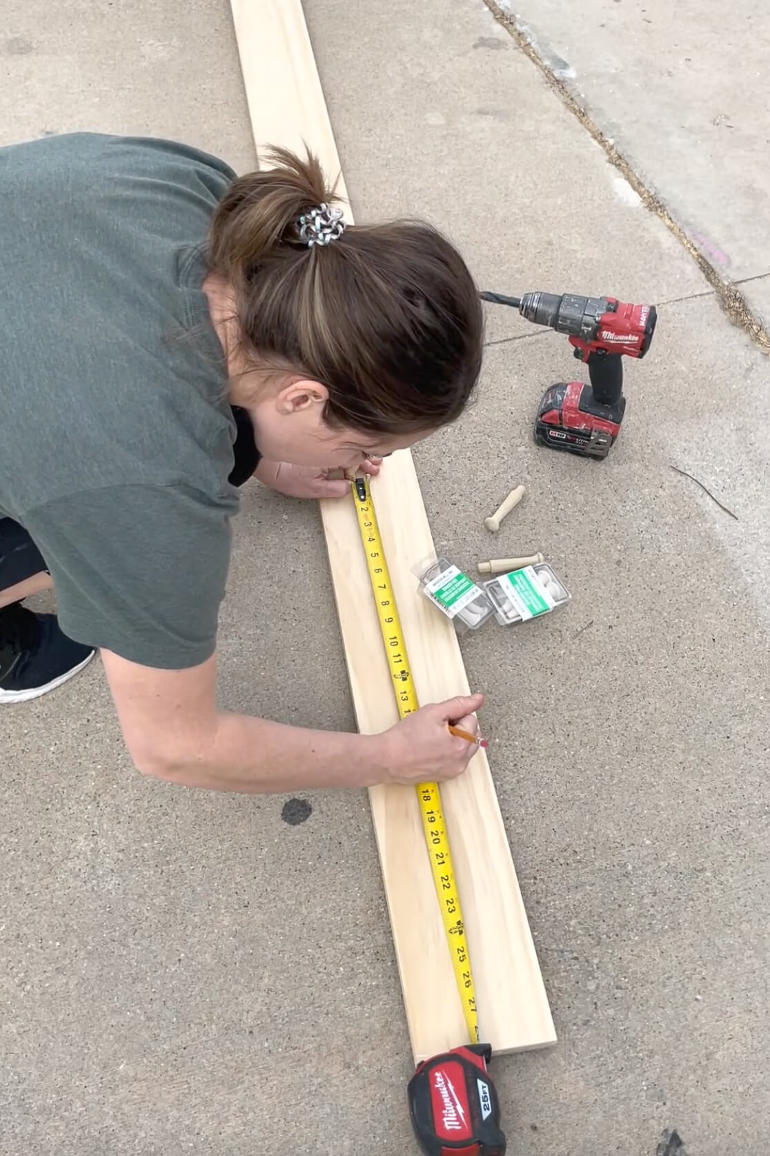 Measuring to add shaker pegs to a board and batten bathroom wall. 